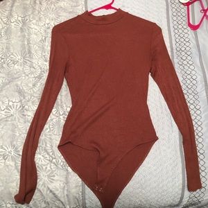 Dark rose colored body suit